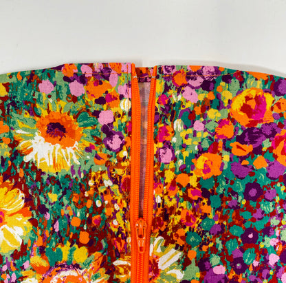 Bright floral catheter bag cover for 2000ml one or two hook hanger bag styles. Empty without removing cover. Zip front keeps cover in place.