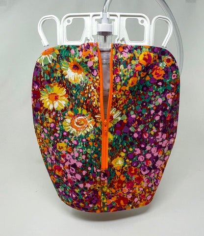 Bright floral catheter bag cover for 2000ml one or two hook hanger bag styles. Empty without removing cover. Zip front keeps cover in place.