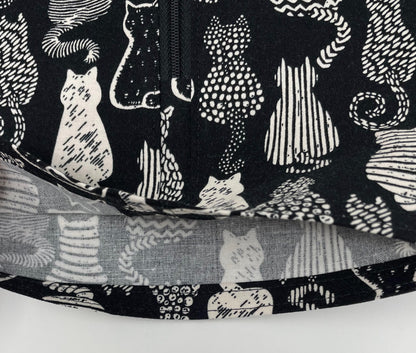 Cats urine bag cover with zip front; open hem to easily access drain port to empty. Catheter bag discreetly hidden from public view, modest