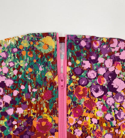 Bright floral catheter bag cover for 2000ml one or two hook hanger bag styles. Empty without removing cover. Zip front keeps cover in place.