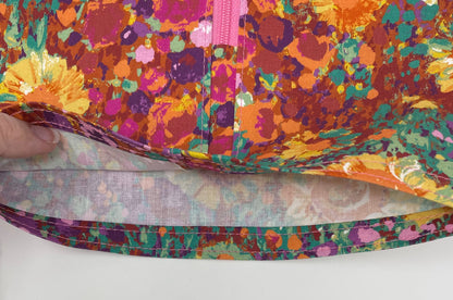 Bright floral catheter bag cover for 2000ml one or two hook hanger bag styles. Empty without removing cover. Zip front keeps cover in place.
